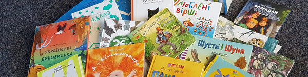 Klick öffnet Text; ein Haufen Kinder-Bücher